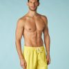 Pastel yellow swim trunks for men